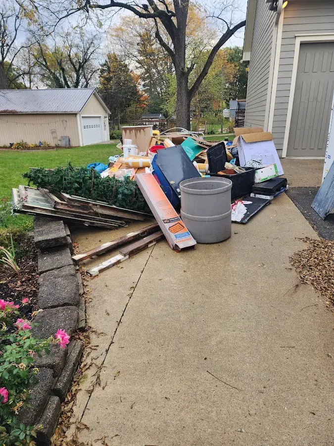 Dumpster being loaded with debris for 30 Yard Dumpster Rental in La Porte